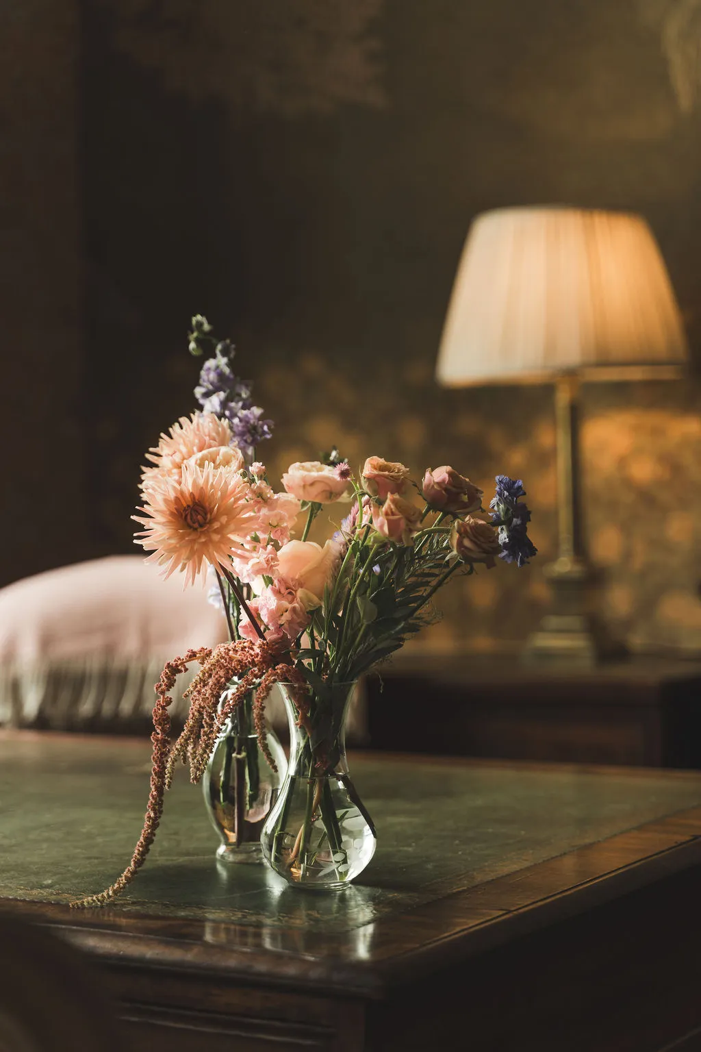 Flowers and lamplight in a quiet corner of the house