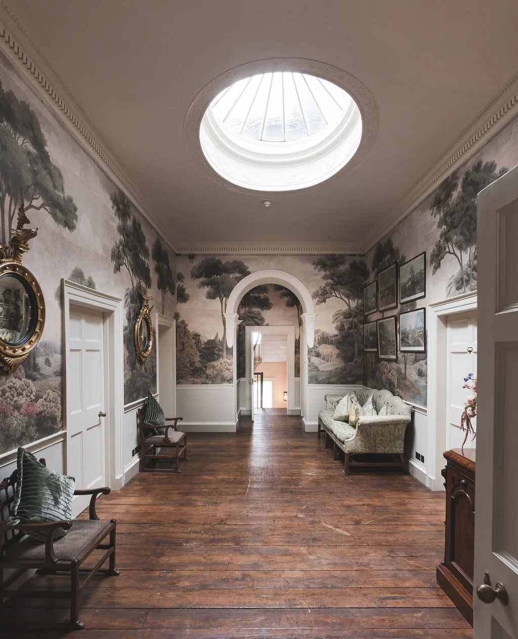 The upper gallery with panoramic landscape murals